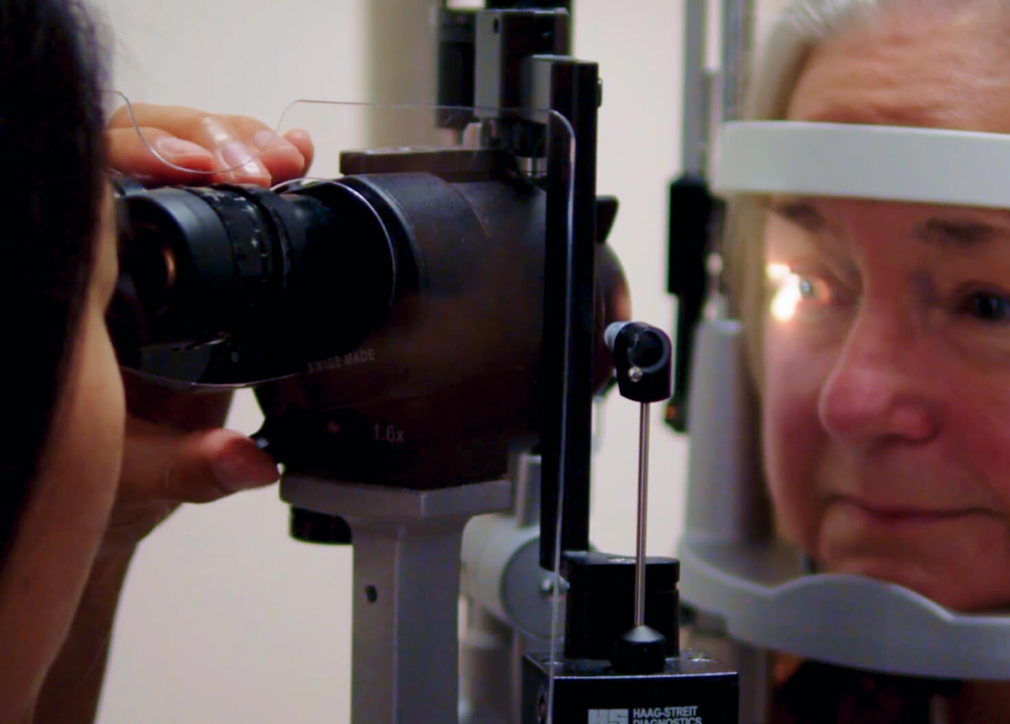 Retina eye exam being performed on an olderly patient